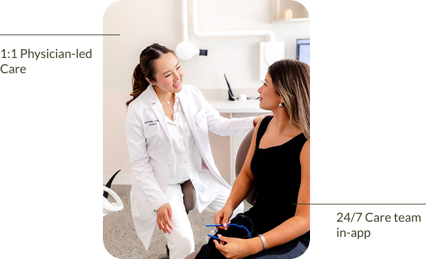 A physician sitting with a member during a one-to-one consultation. 1:1 physician-led care, with a 24/7 care team in the app.