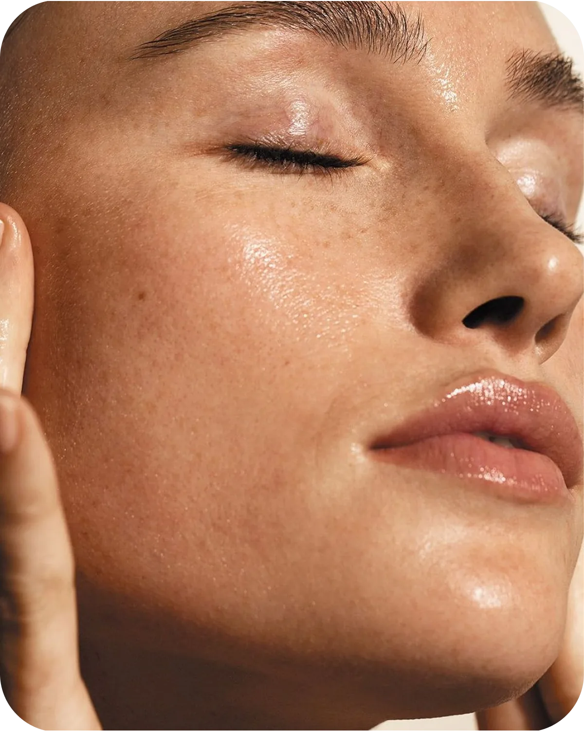 Close-up portrait of a member with healthy, luminous skin.