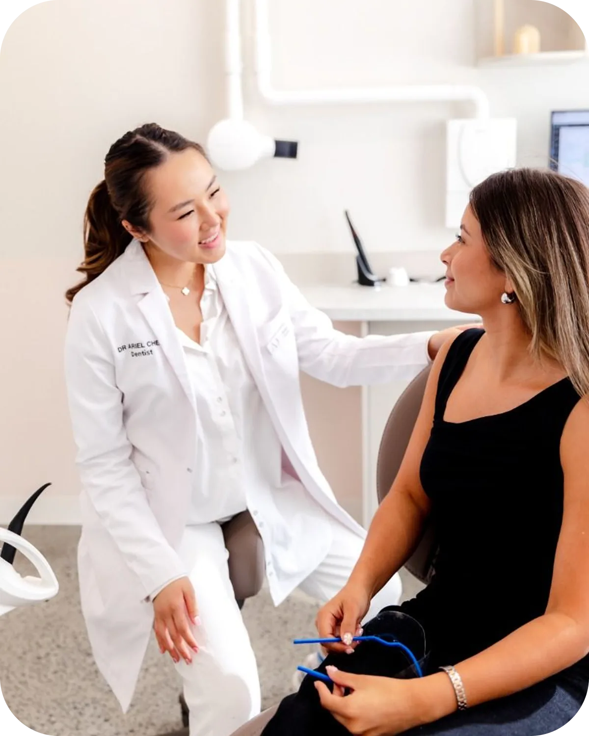 A physician sitting with a member during a one-to-one consultation.